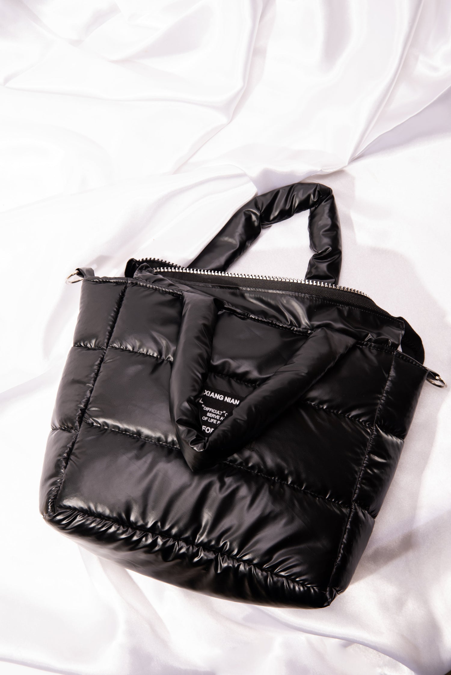 puffer bag for women is a handbag and cross body bag with a perineum design   