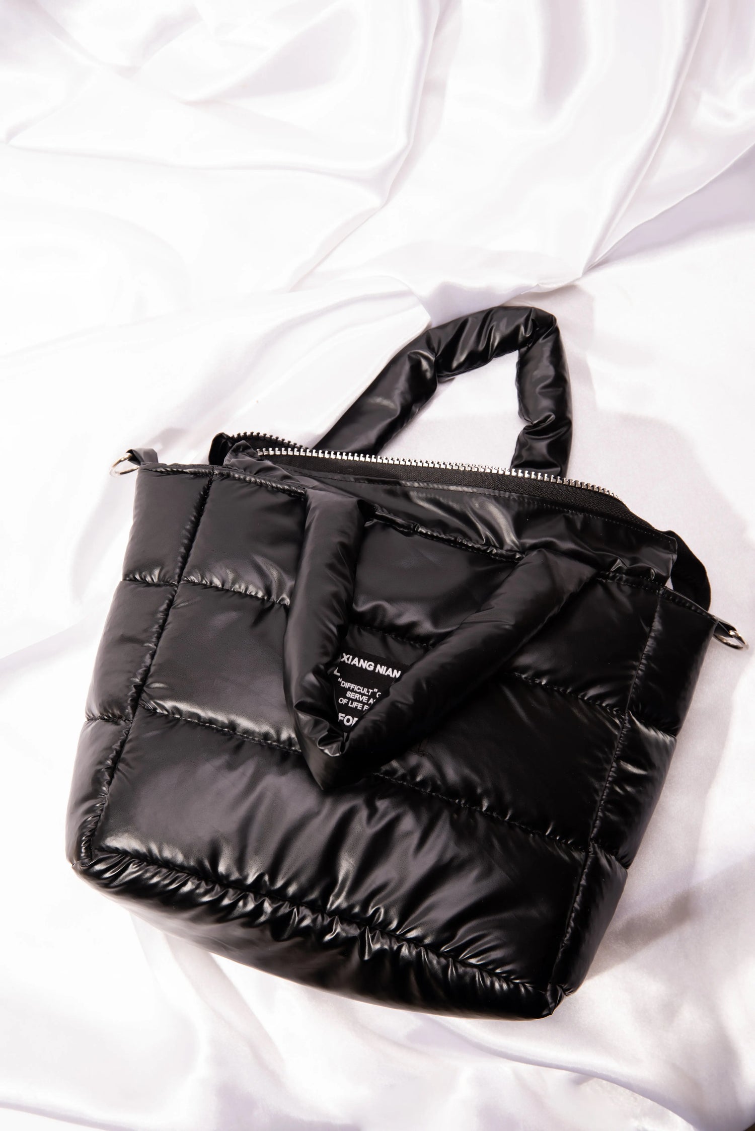 puffer bag for women is a handbag and cross body bag with a perineum design